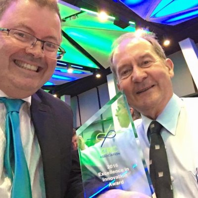 Professor Peter Halley and QUT’s Emeritus Professor Graeme George with the award.